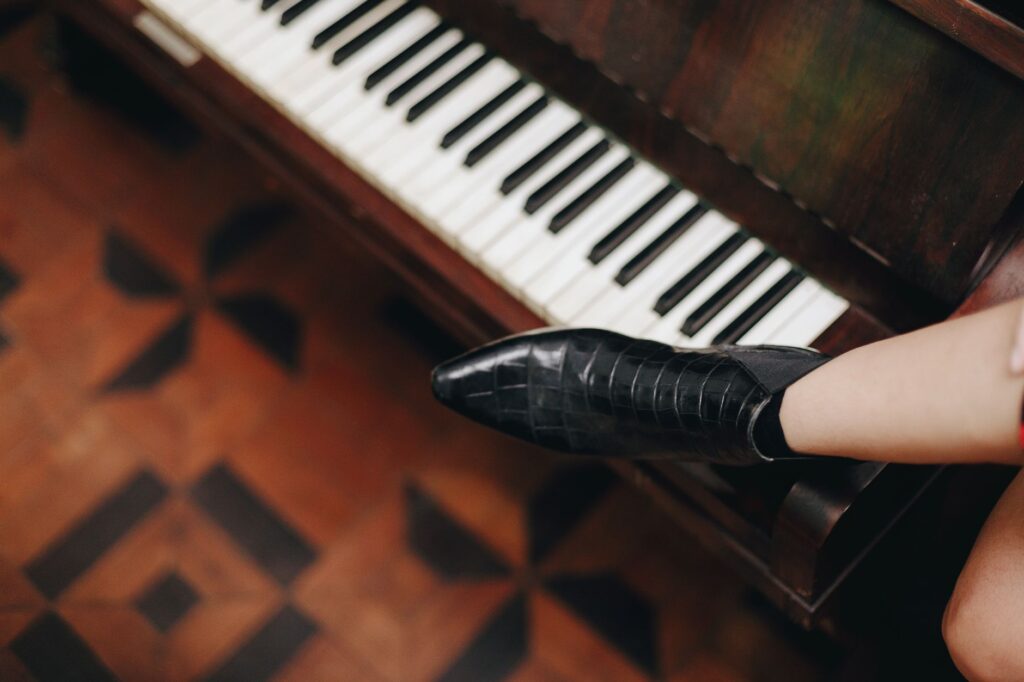 Black ankle boots worn with a dress
