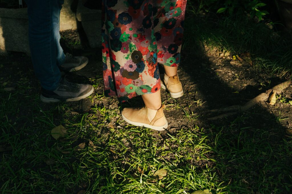 A woman in ankle boots and a fall outfit