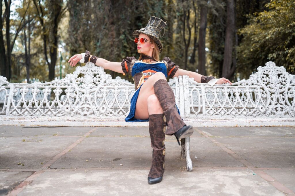 A woman in knee-high boots and a dress