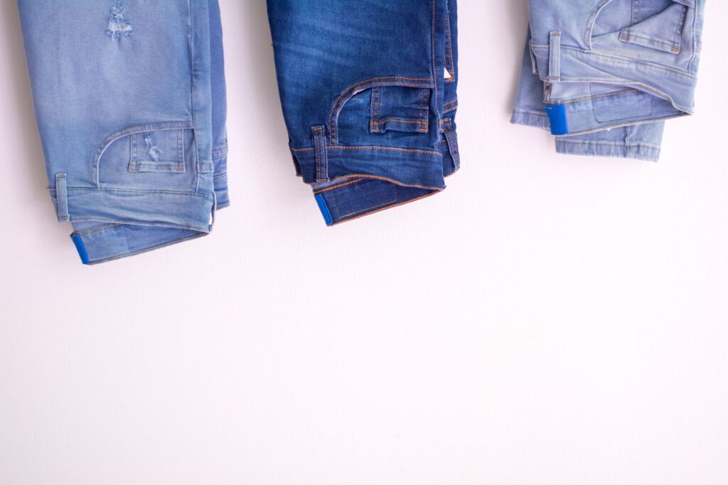 A stack of jeans in different washes