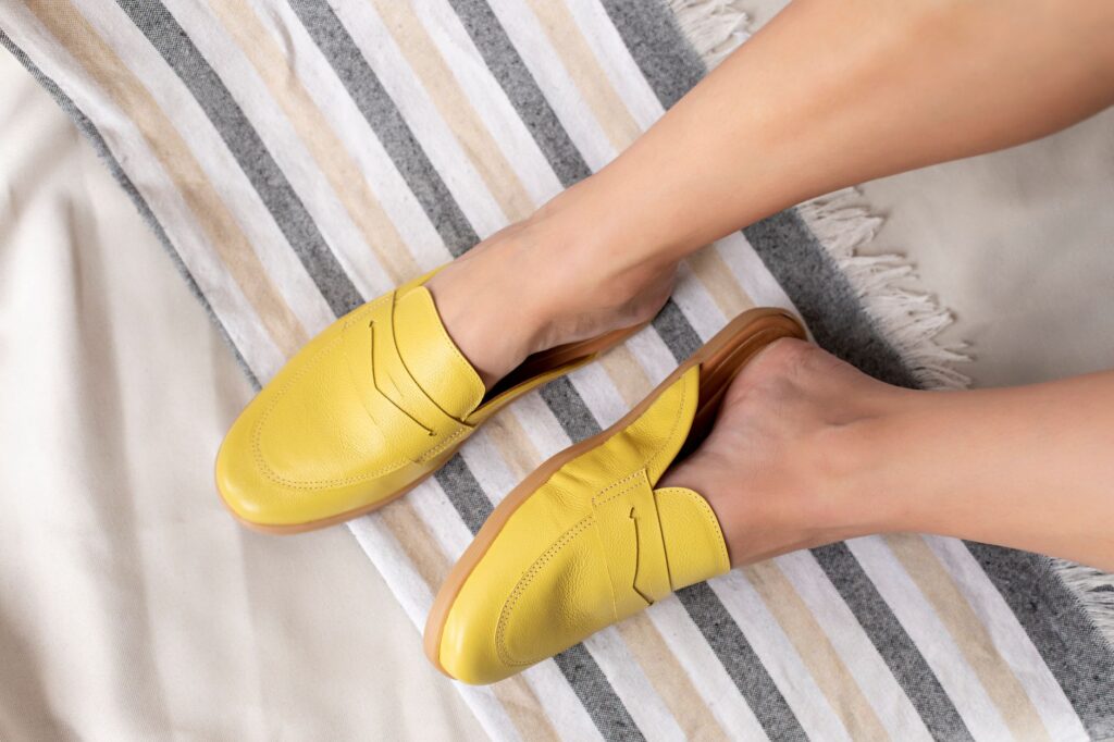 A woman wearing classic leather loafers