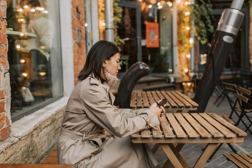 A woman in a classic beige trench coat