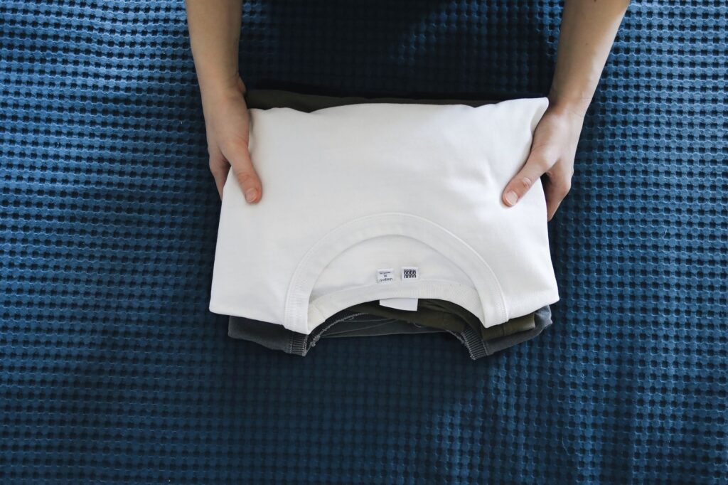 A neatly folded white t-shirt