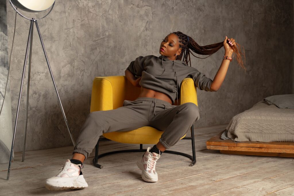 A woman in joggers and a cozy sweater