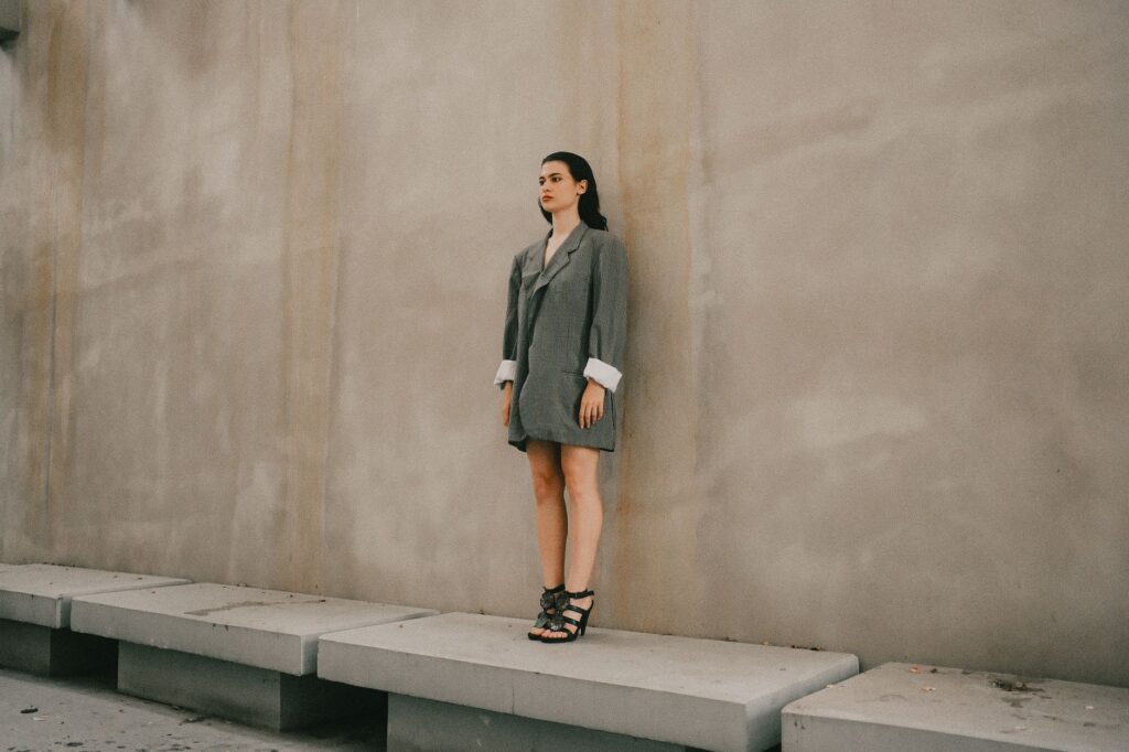 A woman in an oversized blazer and trousers