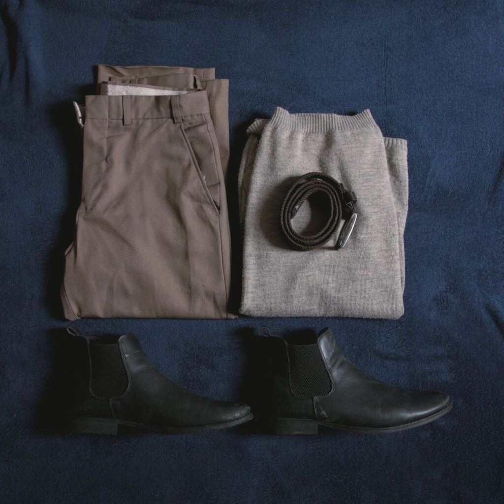 A flat lay of fall essentials in warm neutrals