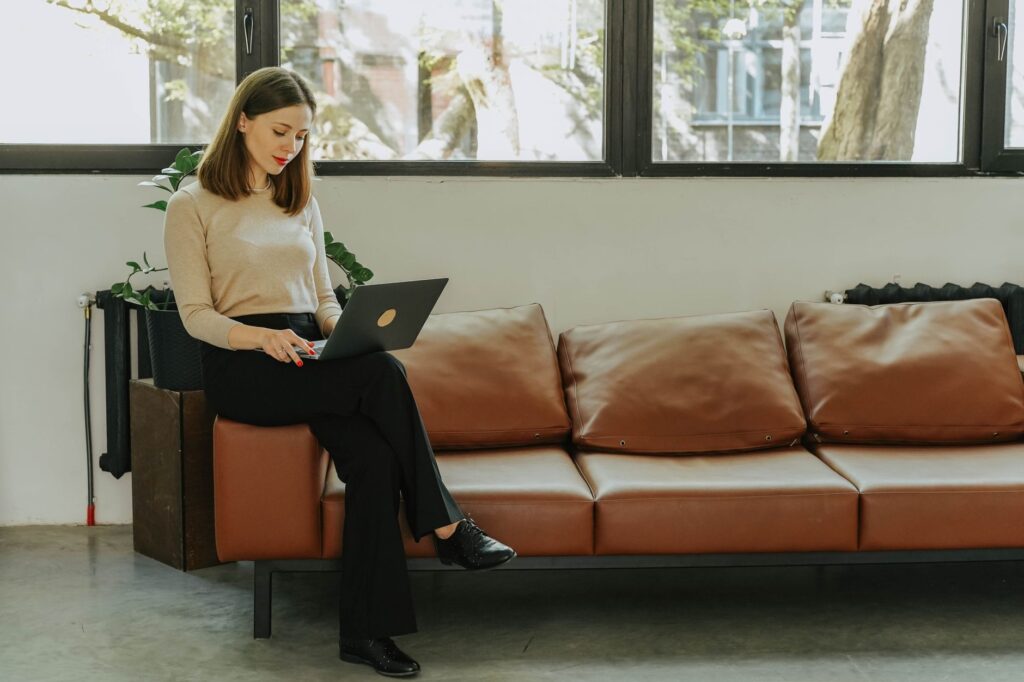A woman in a knit and tailored trousers