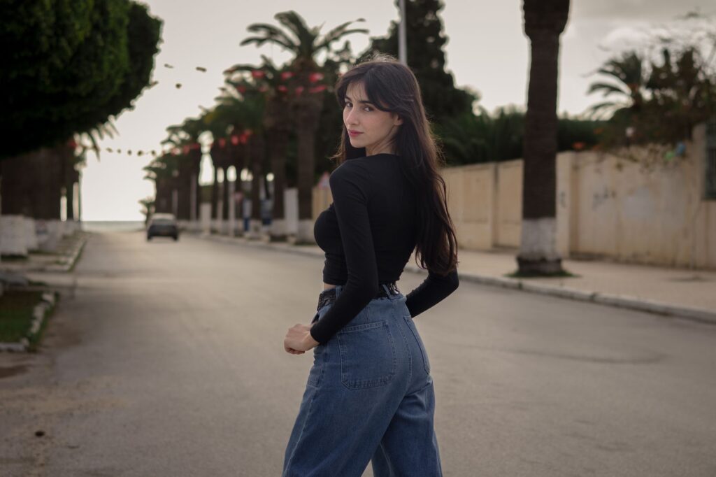 A woman in a striped Breton top and jeans