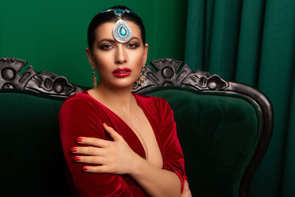 A woman in a velvet holiday outfit