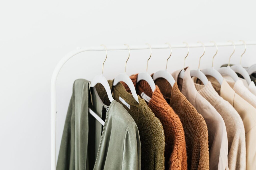 An organized closet of neutral, coordinated clothing