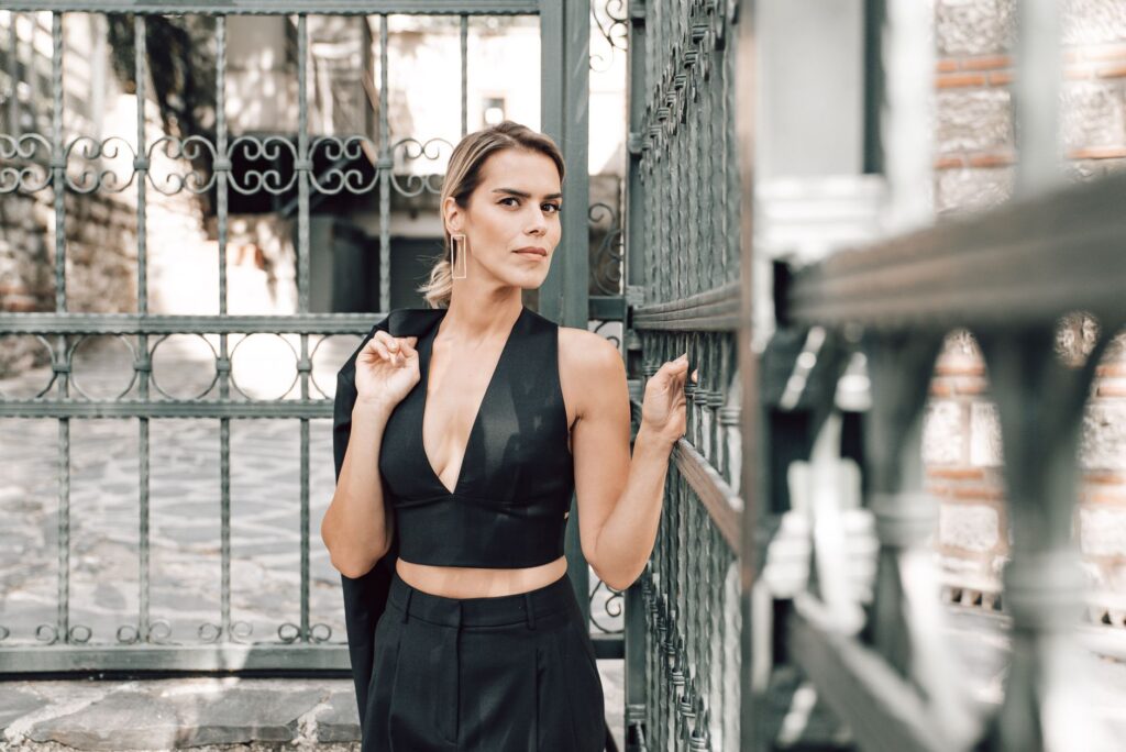 A woman in an elegant, expensive-looking outfit