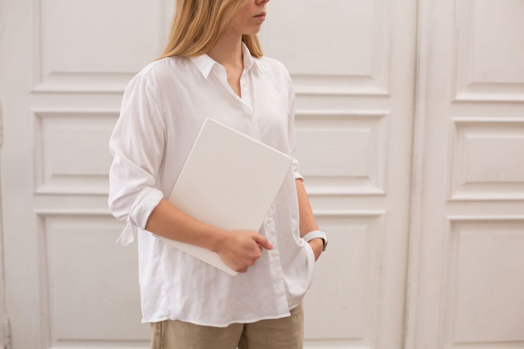A woman in a tonal neutral outfit