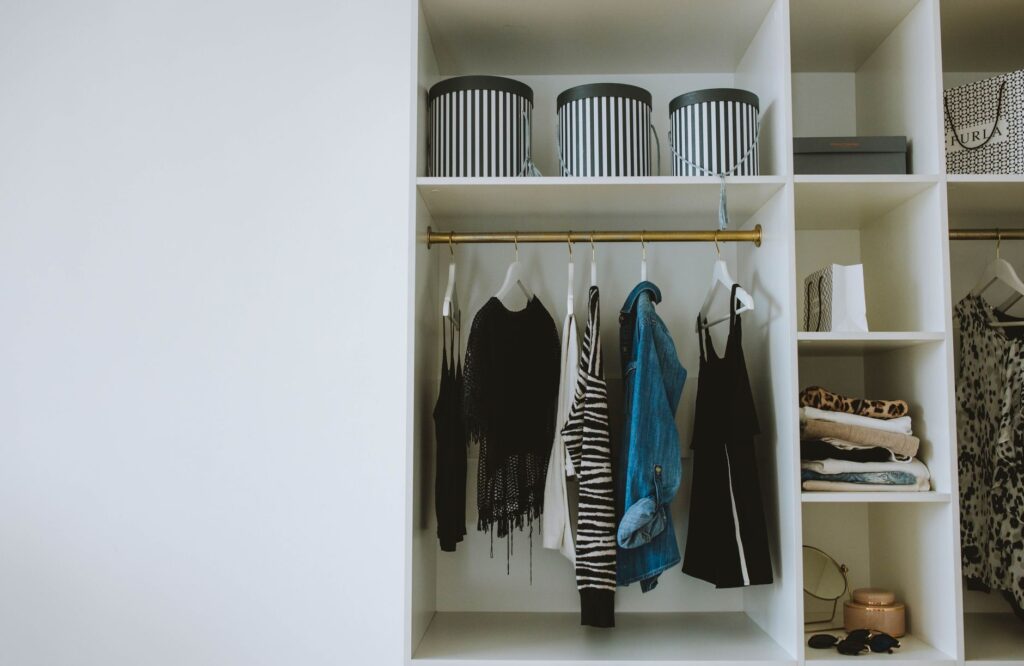 An organized closet full of clothes
