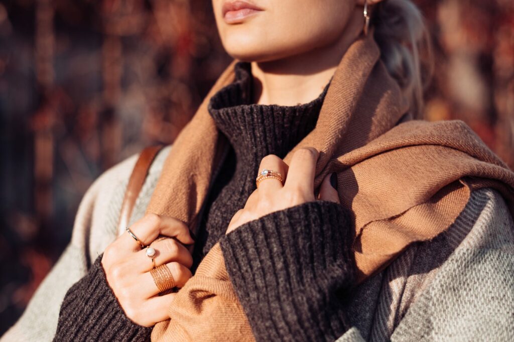 A woman wearing a silk neckerchief