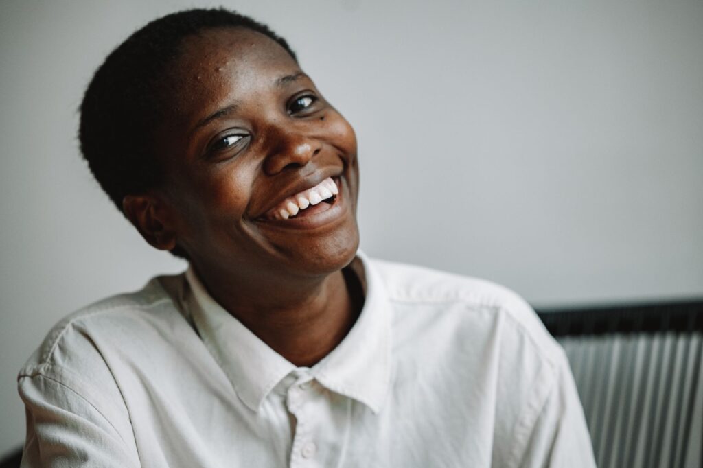 A woman in a crisp white button-down shirt