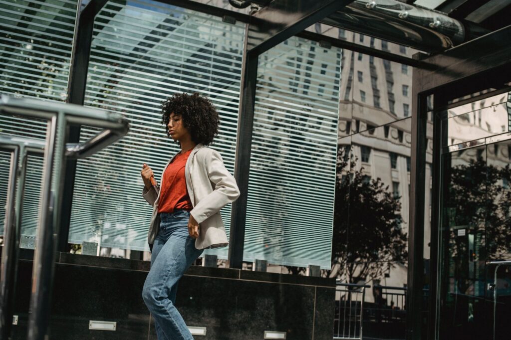 A white shirt styled with jeans and a blazer