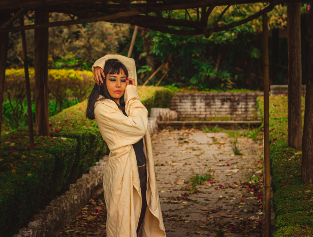 A woman in a tonal cream outfit
