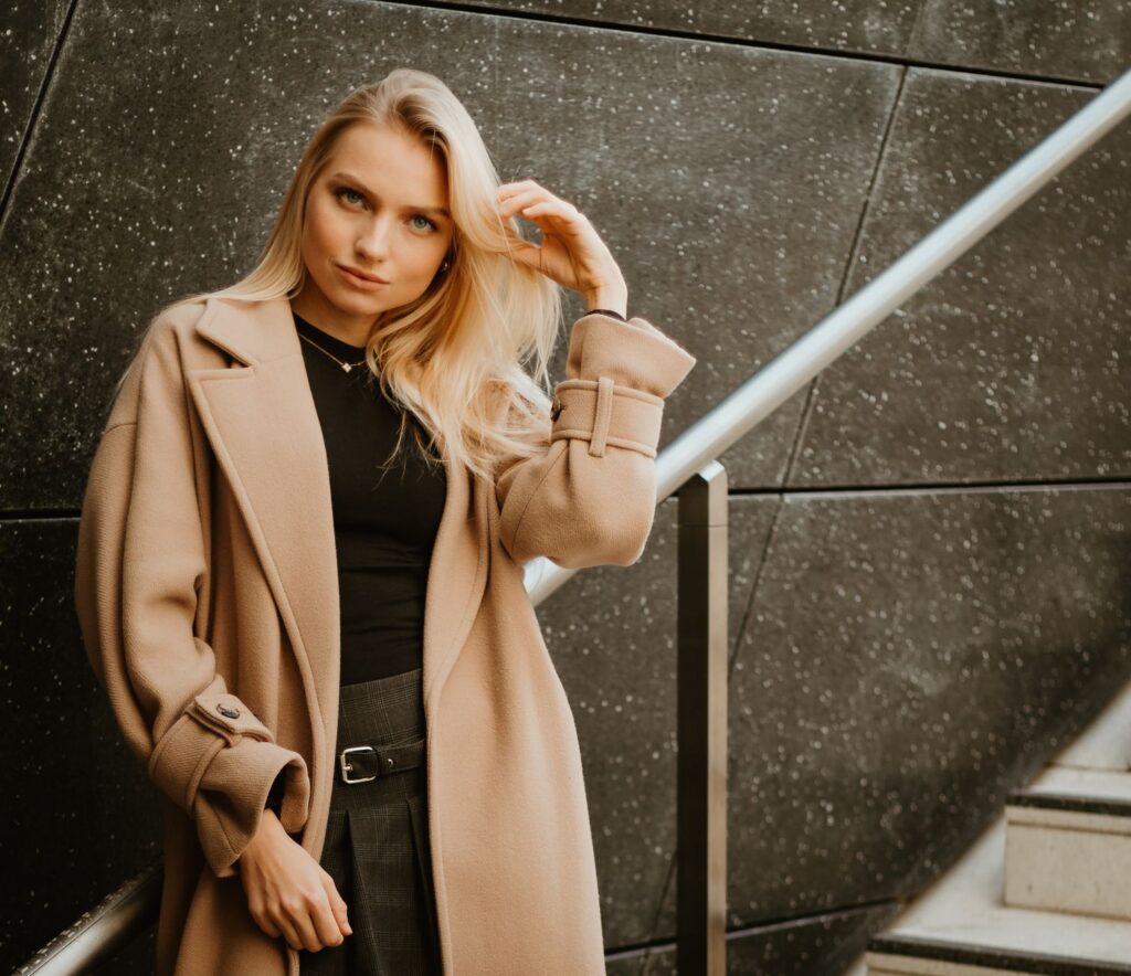A petite woman in a polished outfit