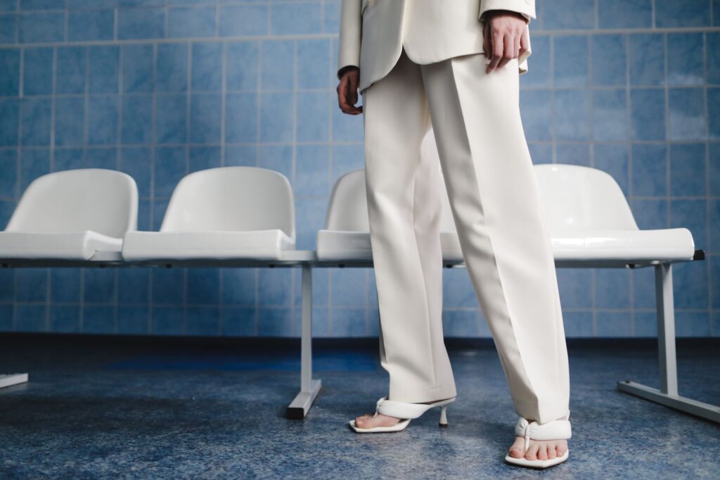 A woman in a tailored blazer and trousers