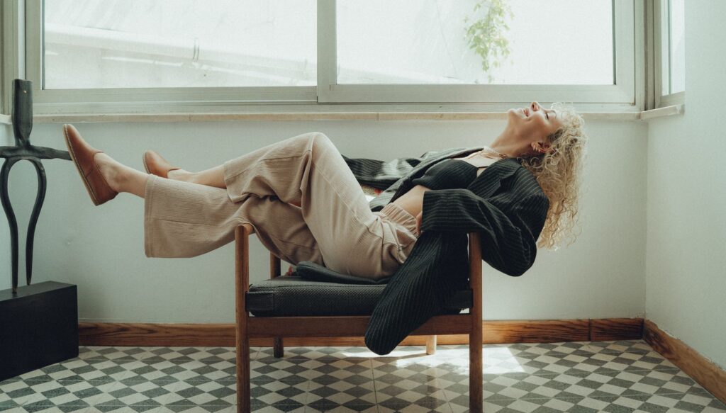 A woman in a tailored blazer and trousers