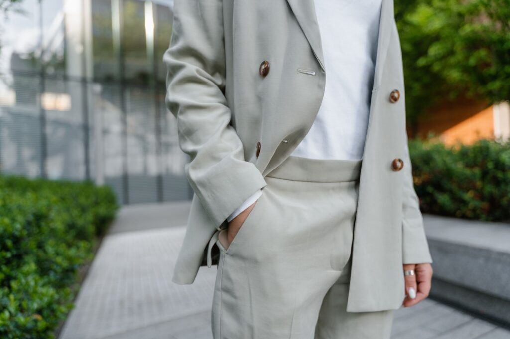A woman in a blazer and tailored trousers