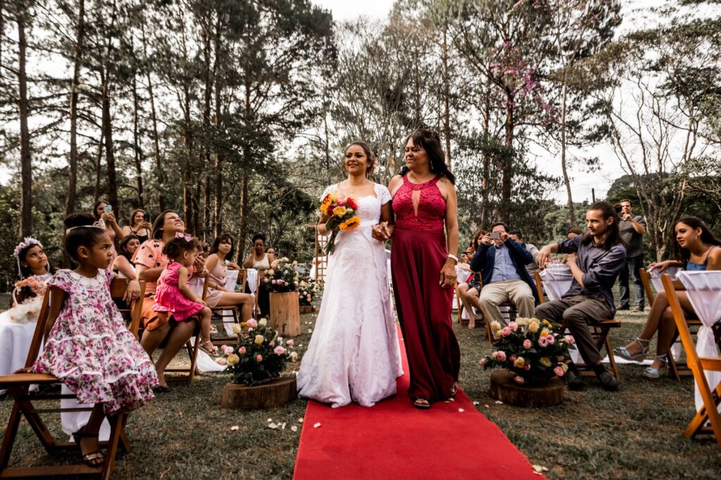 A woman in a jewel-tone wedding guest dress