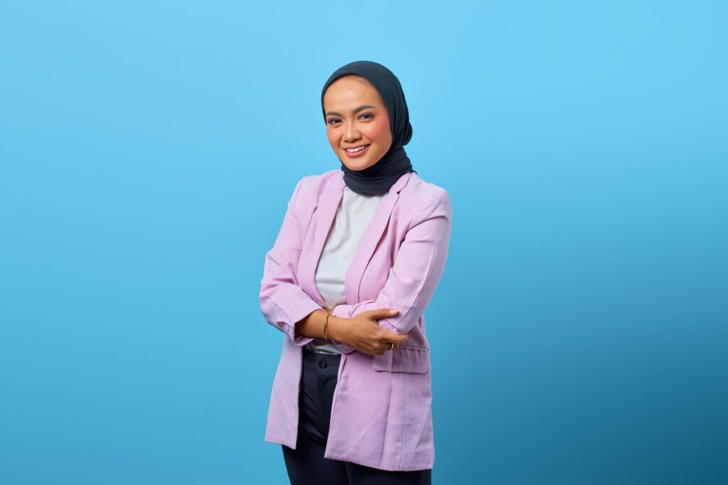 A woman in a blazer and tailored trousers