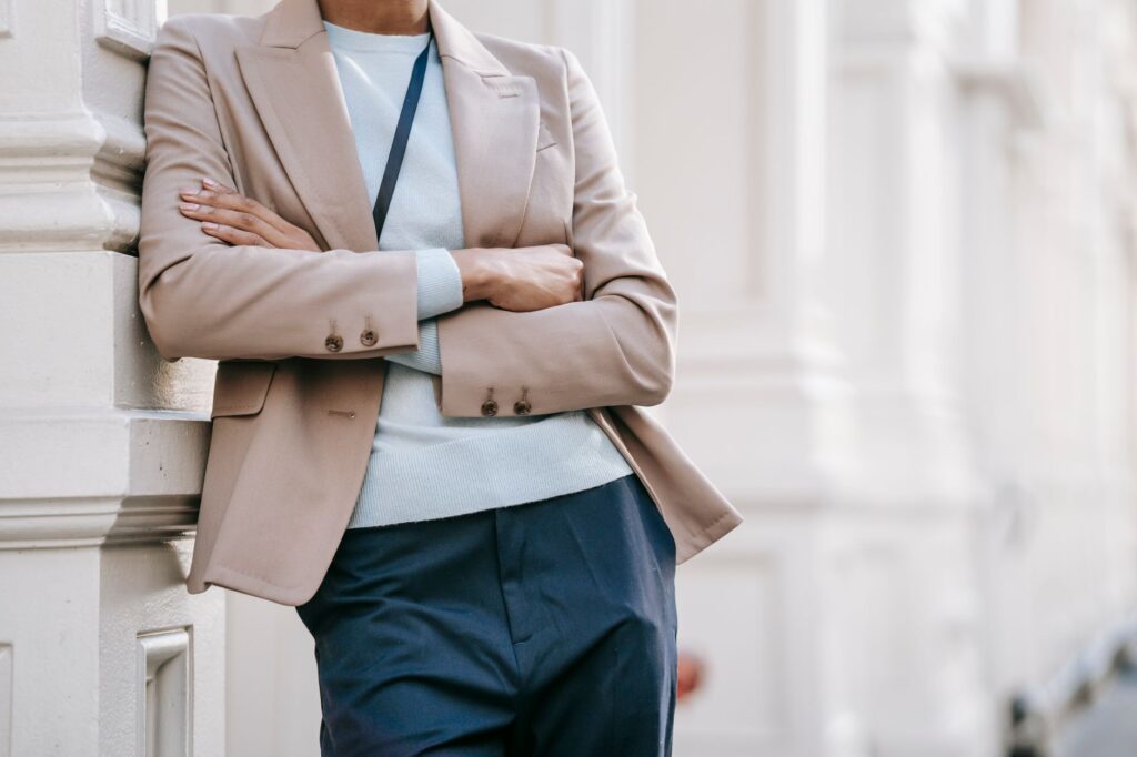 A woman in a tailored blazer and trousers