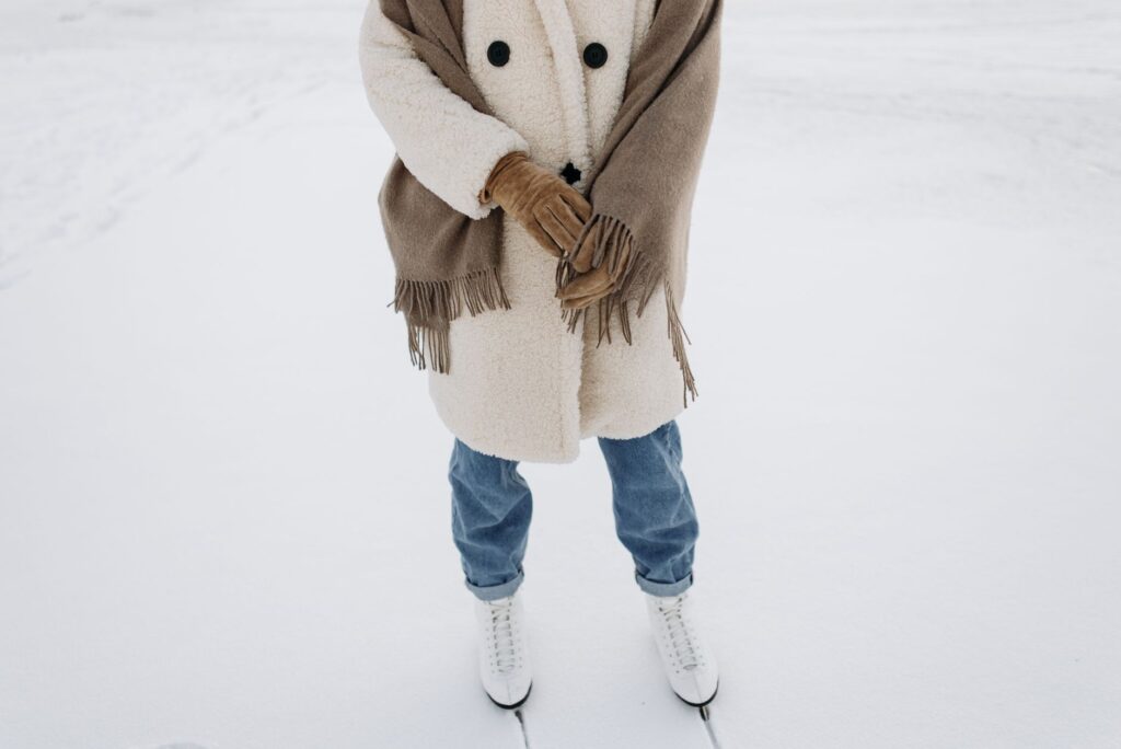 A woman in a wool coat and scarf