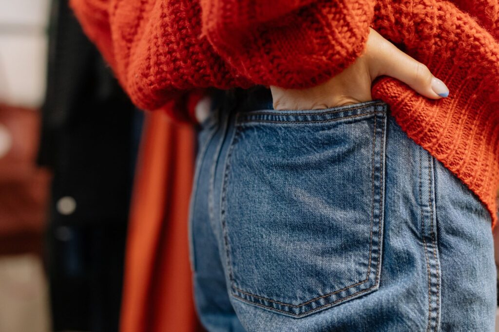A woman in a chunky knit and jeans