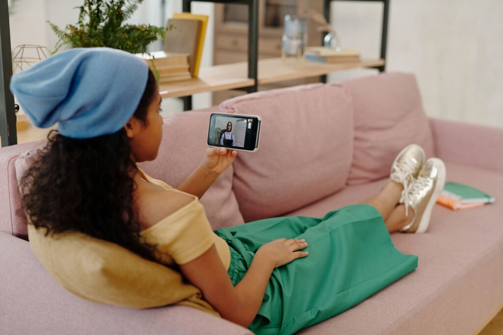 A woman in a knit top ready for a video call