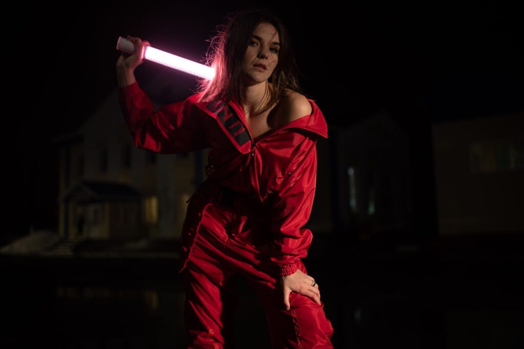 Woman wearing a tailored jumpsuit outfit with accessories