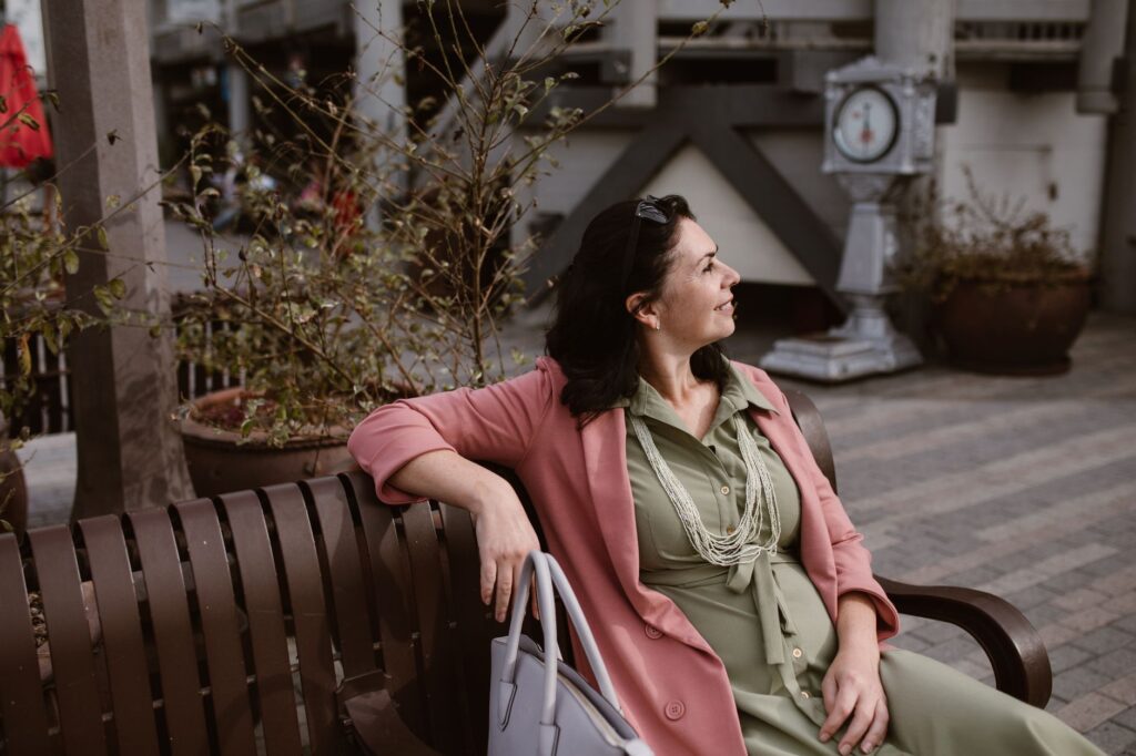 Woman wearing a midi dress with a blazer for a polished work outfit