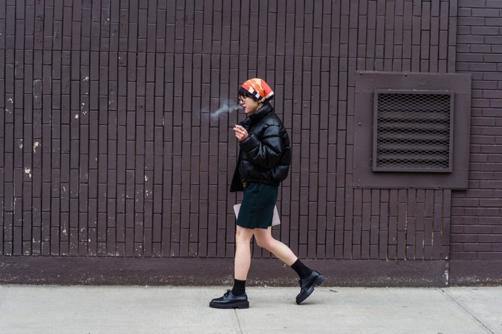 Woman wearing a cropped puffer jacket with jeans in a street style shot