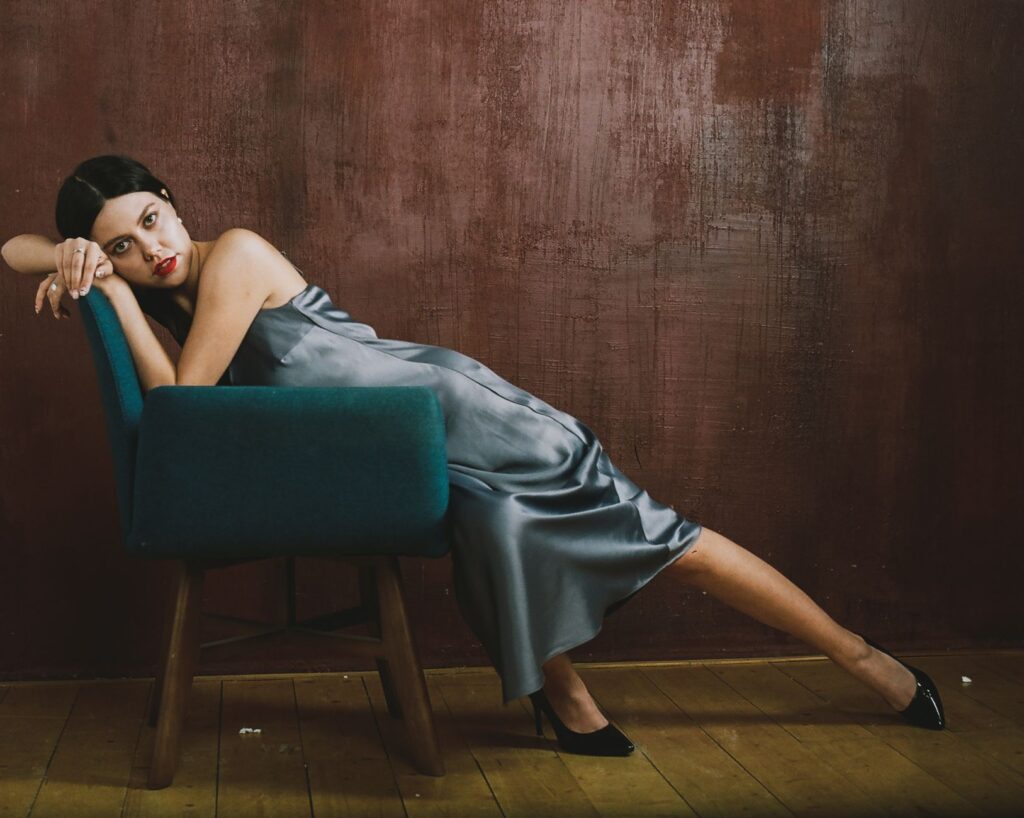 satin slip dress styled with layered pieces