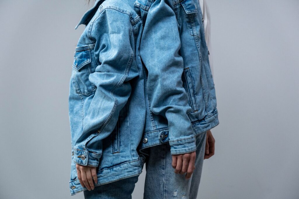 slip dress worn as a top over jeans with denim jacket
