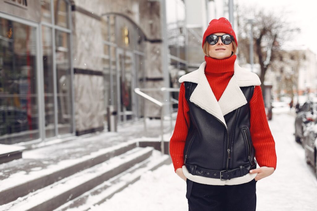 woman wearing a fitted turtleneck sweater with tailored trousers