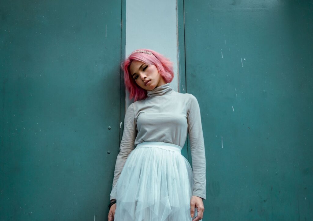 turtleneck tucked into a midi skirt with ankle boots