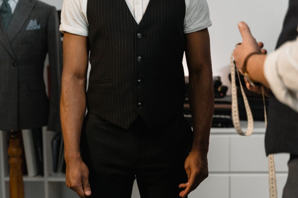 Woman in a tailored waistcoat vest paired with wide-leg trousers