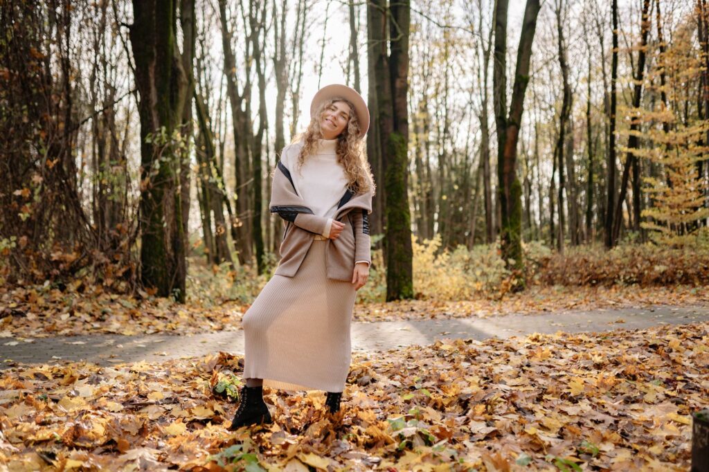 wrap dress layered with boots and a coat for cooler weather