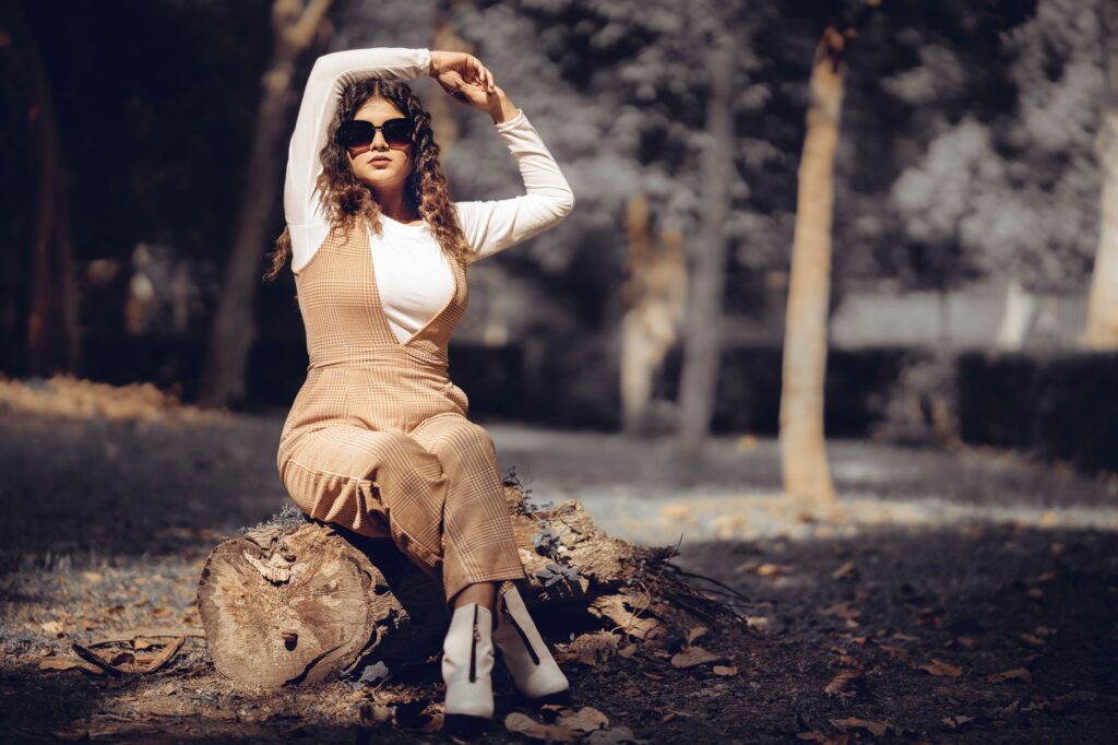 Overalls styled with a fitted turtleneck and ankle boots for fall