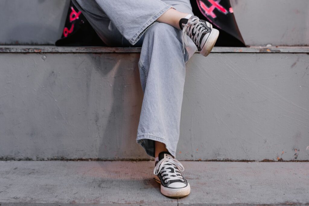 A woman wearing wide-leg jeans in a street style outfit