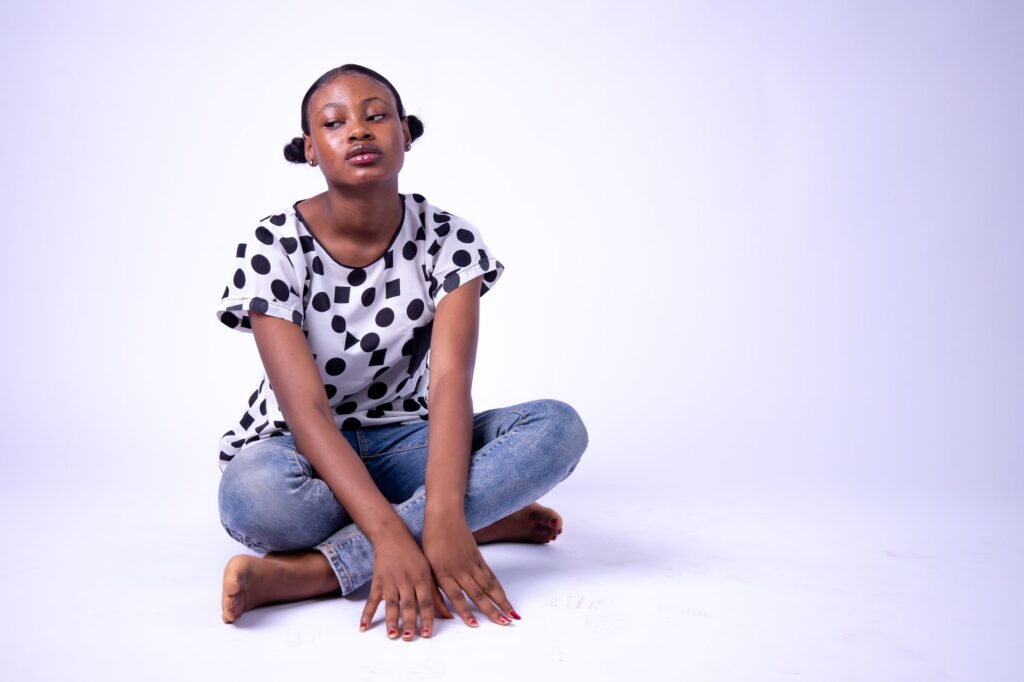 Polka dot blouse tucked into denim jeans for a casual daytime look