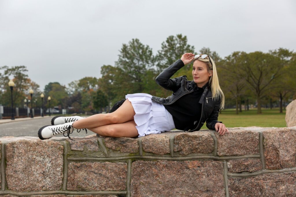 Bomber jacket paired with a midi skirt and combat boots