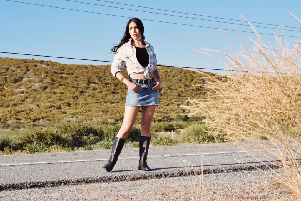 denim skirt paired with ankle boots for a fall outfit