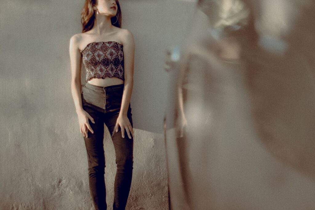 Fitted halter top tucked into wide-leg trousers with heeled sandals