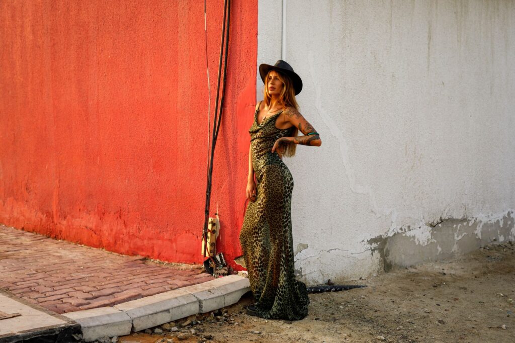 Woman in a boho-style outfit wearing a printed kimono layered over a maxi dress