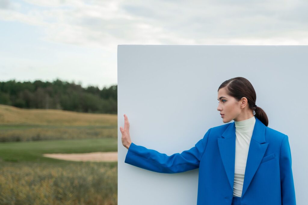 Woman in a tailored pantsuit walking outdoors