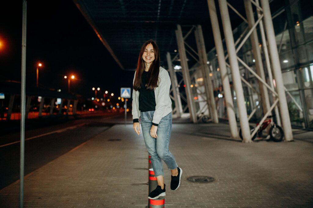 Flare jeans styled with a cropped denim jacket and white sneakers